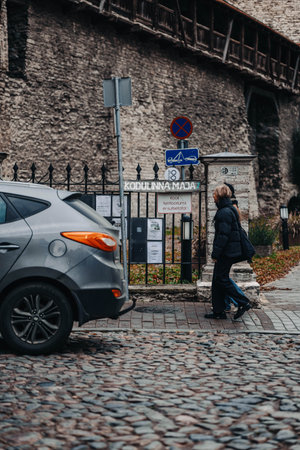 Kodulinna Maja sign by old town city wall in Tallinn, Estonia