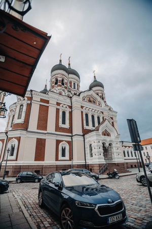 Car parked underneath Alexander Nevsky Cathedral in Tallinn, Estoniaの写真素材