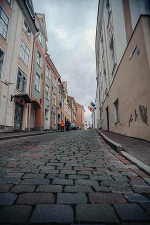 Street in the old town in Tallinn, Estonia on cloudy autumn dayの写真素材