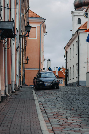 Car parked on street in Tallinn, Estoniaの写真素材