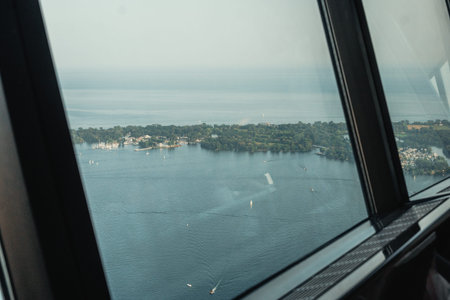 Aerial view of islands and boats in Lake Ontario out of window in the CN Tower