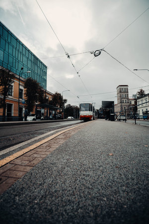 Tram at station in street on cloudy day in Tallinn, Estoniaの写真素材
