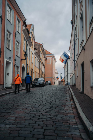 Flags on old town street in Tallinn, Estoniaの写真素材