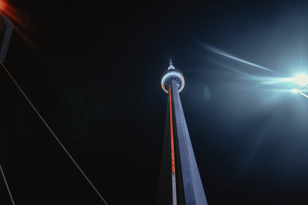 The CN Tower in the night sky from below, Toronto, Ontarioの写真素材