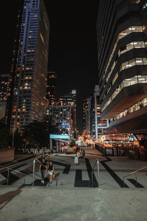 View down street outside the CN Tower at night in Toronto, Ontarioの写真素材