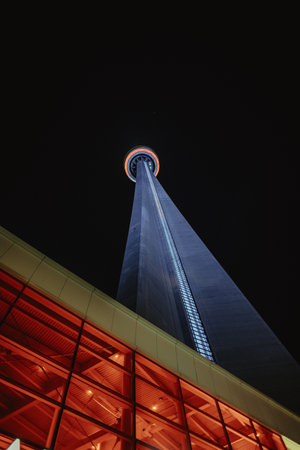 Looking up at the CN Tower at night in Toronto, Ontarioの写真素材