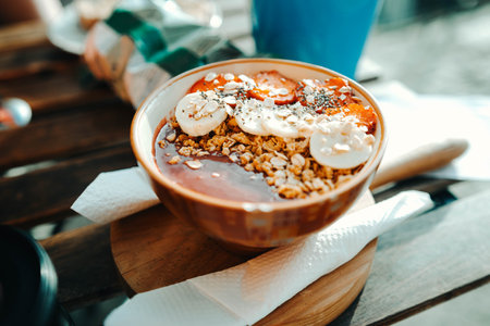 Bowl of food at restaurant in Porto, Portugal, with bananas and strawberriesの写真素材