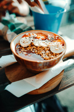 Bananas and strawberries in acai bowl at restaurant in Porto, Portugalの写真素材