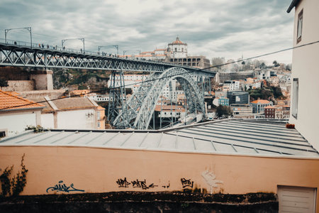Landscape shot of Ponte Dom Luis I bridge on cloudy day in Porto, Portugalの写真素材