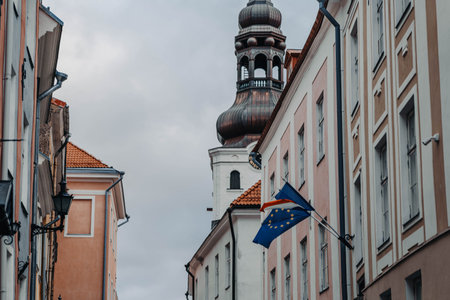 Domed spire above flag in the old town in Tallinn, Estoniaの写真素材