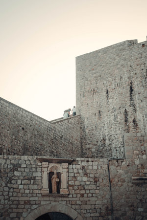 People walking along Dubrovnik old town city wall in Croatiaの写真素材