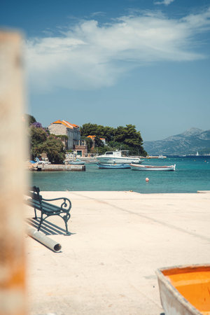 Boats outside houses on sunny day on the Croatian coast near Dubrovnik