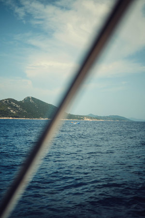 View of kayakers in the sea off Croatian coastline in summerの写真素材