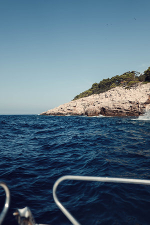 Rocky coastline outside Dubrovnik, Croatia by the sea in summer, from boatの写真素材
