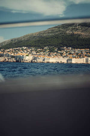 View of Dubrovnik, Croatia through boat bars in summer from the seaの写真素材