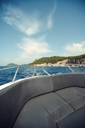 Croatian coastline near Dubrovnik, shot from the front of boat in the sea summer