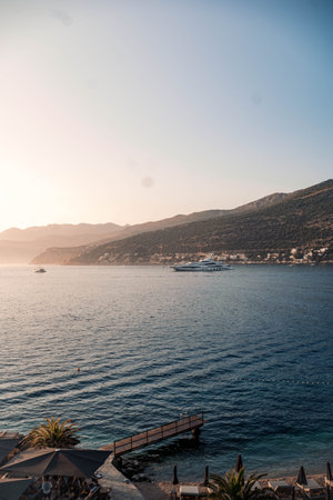 Landscape shot of super yacht in bay at sunset in Dubrovnik, Croatia in summerの写真素材