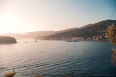 Landscape shot of super yacht in bay at sunset in Dubrovnik, Croatiaの写真素材