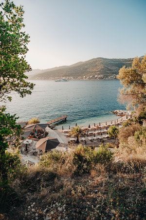 Beach fancy restaurant at golden hour by sea in Dubrovnik, Croatia in summerの写真素材