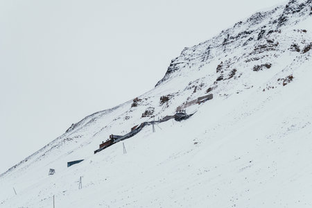 Old abandoned coal mine on snowy mountainside in Longyearbyen, Svalbardの写真素材