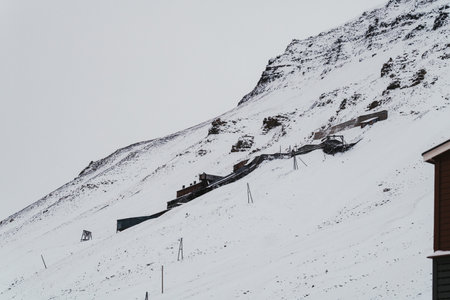 Coal mine abandoned on the side of snowy mountain in Longyearbyen, Svalbardの写真素材