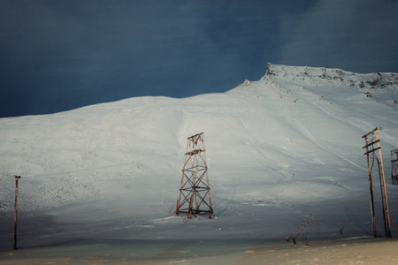 Wooden aerial cableway in the polar night in Longyearbyen, Svalbardの写真素材