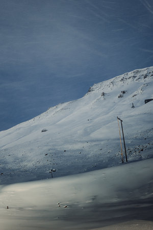 Power lines on snowy mountain in Longyearbyen, Svalbardの写真素材