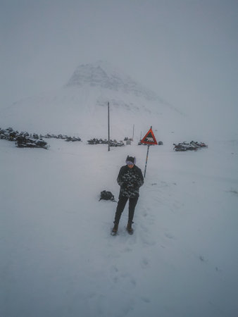 Man stood in the snow in Longyearbyen, Svalbardの写真素材