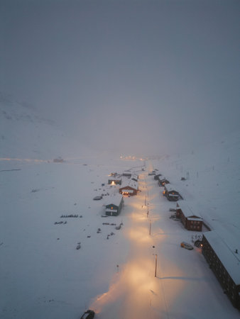 Foggy aerial drone shot of Longyearbyen, Svalbard in winterの写真素材