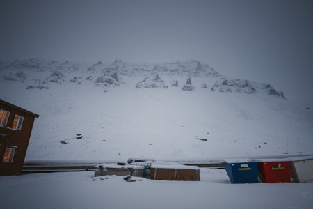 Snowy arctic mountains in the fog in Longyearbyen, Svalbard, far northの写真素材