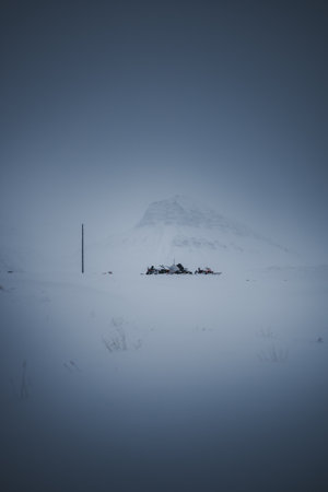 Snowmobiles parked in the fogの写真素材