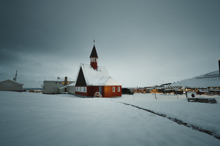 The church above Longyearbyen, Svalbard on overcast snowy winter dayの写真素材