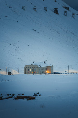 A building in the snow in Longyearbyen, Svalbard in the polar night