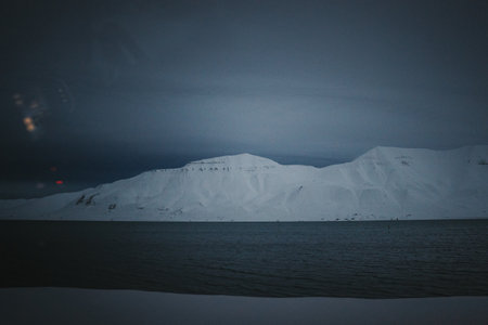 Snowy arctic fjord from car window in Longyearbyen, Svalbard in the polar nightの写真素材