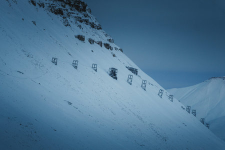 Mining cable tramway on snowy mountain in Longyearbyen, Svalbard in polar night