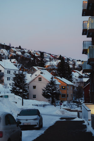 Residential houses covered in snow in the center of Tromso, Norwayの写真素材