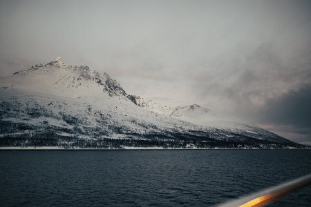 Snowy Lyngen Alps, arctic mountains in winter in northern Norwayの写真素材