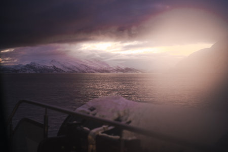 Sunset view over winter fjord between arctic mountains in the Lyngen Alps Norwayの写真素材