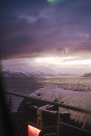 Sunset view over fjord between arctic mountains in the Lyngen Alps, Norwayの写真素材