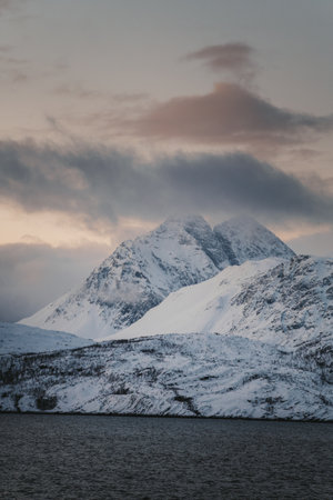 Lyngen Alps at sunset under clouds in northern arctic Norwayの写真素材