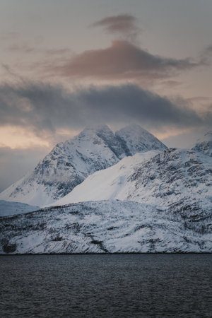 Snow covered mountains of the Lyngen Alps at sunset in northern arctic Norwayの写真素材