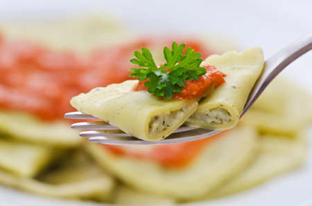 Sliced ravioli on a fork の写真素材