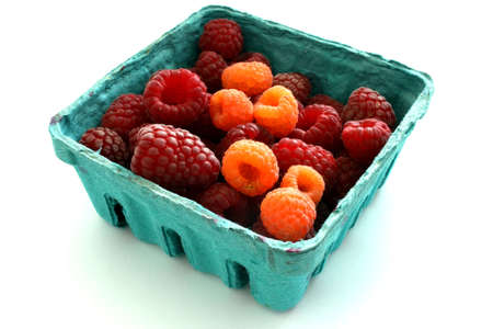 A basket of various organic raspberries from the local farmers marketの写真素材