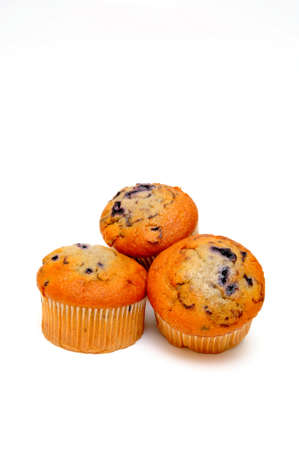 Three berry muffins on a light colored backgroundの写真素材