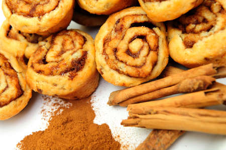 Powdered and stick cinnamon with freah baked mini cinnamon rollsの写真素材