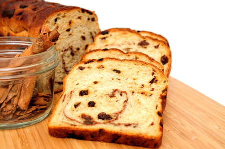 Slices of raisin cinnamon bread with slices laid out showing the detail in the slice including the raisinsの写真素材