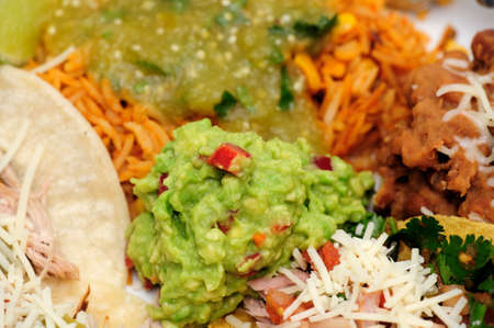 Fresh Guacamole on a plate of Mexican Carnitas tacoの写真素材
