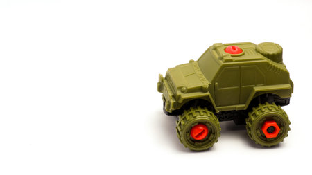 Children's Toy Military Car On Isolated White Backgroundの写真素材