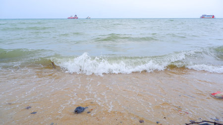 Natural View Of Rolling Tidal Waves Against The Backdrop Of Several Tankers, On Tanjung Kalian...