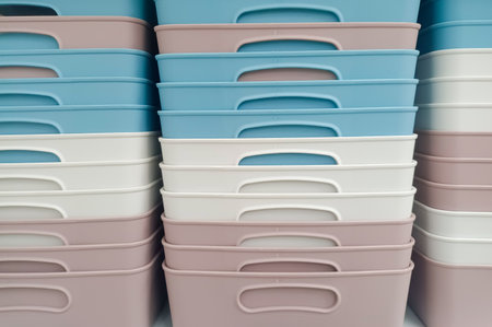 Square-shaped Plastic Baskets With A Variety Of Colors, Arranged Neatly And Tightly On A Shelfの写真素材